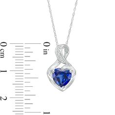 Gift her a charming and elegant symbol of your love with this heart-shaped blue lab-created sapphire and diamond accent pendant. Crafted in cool 10K white gold This look glistens with a 7.0mm heart-shaped bright blue lab-created sapphire. A diamond-accented ribbon loops around the center stone and artfully forms the twist bail above. Blue sapphire is the traditional birthstone for September and symbolizes truth, sincerity and commitment. The pendant suspends along an 18.0-inch rope chain that secures with a spring-ring clasp. Heart Cut Sapphire Gemstone Jewelry, Sapphire Heart Cut Birthstone Jewelry, Sapphire Heart Pendant Jewelry For Anniversary, Heart Cut Sapphire Birthstone Jewelry, Heart-shaped Sapphire Jewelry For Formal Occasions, Sapphire Heart Cut Gemstone Jewelry, Formal Heart-shaped Sapphire Jewelry, Anniversary Necklace With Lab-created Sapphire Birthstone, Sapphire Heart Pendant Birthstone Jewelry