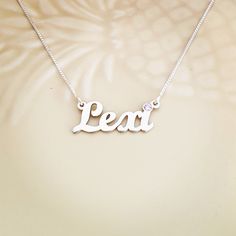 Order any word or name, for your new sterling silver 925 Lexi style name necklace! Choose any swarovski birthstone for the dot of the i, or the first capital letter . *Nameplate and chain are all solid sterling silver 925. *First capital is 1.0 cm tall (0.4 inches). *Nameplate thickness is 1.2 mm. *Choose any birthstone you would like to have placed on you name! *Choose your chain length from the menu above. *Be sure to tell me the name that you would like in the NOTE TO SELLER section of your e Lexi Name, Silver Nameplate Birthstone Necklace For Birthday, Birthday Sterling Silver Nameplate Birthstone Necklace, Custom Name Silver Birthstone Nameplate Necklace, Silver Nickel-free Nameplate Necklace, Nickel-free Sterling Silver Name Necklace, Spell Your Name, Rachel Clark, The Dot