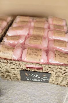 some pink soaps are in a wicker basket