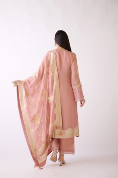 Stunning dusty pink embroidered Banarasi weave kurta set is a perfect festive wear. It comes with a matching dupatta. Shop online from Pure Elegance. Disclaimer: The actual product may vary slightly from the image. These are custom orders, hence expect slight variation in color and placement of the motif or buta. ESTIMATED DELIVERYBecause this is a custom order, it would take about 4 weeks from the date of purchase. RETURN POLICYThis product is a custom order and cannot be returned or exchanged. Pink Slub Silk Palazzo Set With Zari Work, Festive Pink Slub Silk Palazzo Set, Pink Embroidered Slub Silk Set, Designer Pink Slub Silk Traditional Wear, Pink Semi-stitched Slub Silk Sets, Pink Slub Silk Palazzo Set With Dabka Work, Pink Slub Silk Salwar Kameez For Eid, Pink Slub Silk Traditional Wear With Sheer Dupatta, Pink Embroidered Raw Silk Palazzo Set