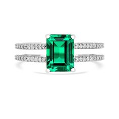 Presenting our Vintage Colombian Created Emerald Ring, crafted in 925 Sterling Silver with a lustrous White Rhodium Over Silver. This Green Gemstone Ring piece features an octagon-cut Colombian Emerald as the main stone, measuring 8x6mm and weighing 1.8 carats, exuding elegance. With a metal weight of 3.50 grams, this ring is available in sizes 5, 6, 7, and 8. Adorned with shimmering Moissanite accents, this double band ring makes a bold statement. Perfect as a May birthstone ring or a vintage-i Dazzling Gemstone Ring For May Birthstone, Dazzling Emerald Cut Gemstone Rings, Dazzling 14k White Gold Emerald Cut Ring, Radiant Cut Rings With Center Stone For May Birthstone, Dazzling Octagon Rings With Center Stone, Dazzling Octagon Ring With Center Stone, Sterling Silver Octagon Ring With Accent Stones, Dazzling Octagon Ring For Anniversary, Octagon Emerald Ring In Sterling Silver With Prong Setting