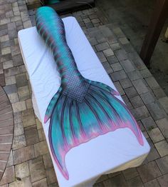 an image of a mermaid tail on a mattress