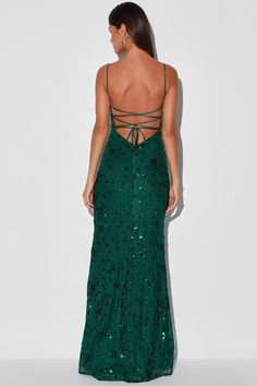 Get ready for 'gram-worthy pics all night when you're in the Lulus Photo Finish Forest Green Sequin Lace-Up Maxi Dress! Shiny green sequins create a floral design atop sheer mesh as it shapes this sultry dress that sweeps from tying straps that lace-up across a sexy open back and into a deep V-neckline and a darted bodice with padded cups. A high empire waist flows into a figure-skimming mermaid maxi skirt. Hidden back zipper. Fit: This garment fits true to size. Length: Floor length. Size mediu Forest Green Prom Dress, Sultry Dress, Forest Green Dress, Mermaid Maxi Skirt, Forest Green Dresses, Green Sequin Dress, Lulus Maxi Dress, Prom Dress Shoes, Fashion Formal