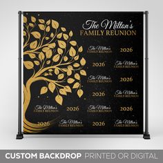 a black and gold family reunion sign with a tree on the front, next to it is