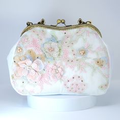 New to our Millennium collection, This beautiful romantic White Embroidered Lace Pink Blue Floral Garden Wedding Bag is made of very fine quality of fabric and metal and it comes with a long Detachable chain for your Big day! Dimensions- length oh the bag is 10 inches and width of the bag is 7 inches. chain measure about 47 inches long. ► ABOUT YOUR ORDER * All items are neatly packaged in our beautiful jewelry boxes and elegant organza bags. * All items are 100% gift-ready. * Each order comes with a personalized handwritten card and a branded Millennium Bride jewelry cloth. * Each order comes with a free gift. ► PERSONALIZTION * If your order is a gift, you may contact us with the recipient's name or a message, and we'll print a personalized card that will be elegantly packaged with your Vintage Handheld Shoulder Bag For Wedding, Vintage Handheld Shoulder Bag For Weddings, White Embroidered Handheld Evening Bag, Vintage Pink Bags For Wedding, Vintage Pink Bags For Weddings, Pink Pouch Shoulder Bag For Wedding, Pink Floral Embroidery Evening Bag, Vintage Wedding Clutch Shoulder Bag, Pink Vintage Wedding Bag