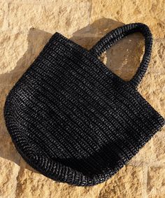 Woven Raffia Tote BlackPerfect for anything from summer getaways to farmers market runs, this packable tote bag is the ultimate accessory to always have on hand.Crochet raffia tote bag.Made in China.Wide-looped handles make it the perfect piece for days on the go. Cheap Black Woven Straw Bag, Lightweight Straw Tote Bag, Black Natural Fiber Beach Bag For Daily Use, Black Vacation Basket Bag, Black Crochet Bag For Everyday Summer Use, Black Summer Straw Bag For Everyday Use, Black Straw Bag For Everyday Summer Use, Black Rectangular Shoulder Bag In Natural Fiber, Black Crochet Tote Bag For Travel