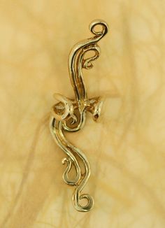 This French Twist Ear Cuff is cast in bronze and is elegant and fluid and can be worn on either the left or the right ear (diamond not included). Our ear cuffs require no piercings. Starting near the top of the ear, slide the ear cuff down along the edge of the ear's cartilage. You may gently open or close the opening of the ear cuff to accommodate the thickness of your ear. Our bronze ear cuffs are antiqued lightly, and bronze will tarnish, or patina over time. To maintain the golden color, cle Travel Charm Bracelet, Minimalist Ear Piercings, French Images, Minimalist Ear Cuff, Double Ear Piercings, Wave Jewelry, Ear Climber, Bronze Earrings, Wrap Earrings