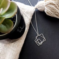 Squares necklace, Cube necklace, silver square, geometric necklace, geometric jewelry, cube pendant, square charm, Minimalist necklace*** Free shipping***Made of high-quality Silver plated brass base.* Nickel freeTotal length: 16.5"size of pendant: 1.1" x 1.3"Squares necklace- In Gold finish: https://www.etsy.com/uk/listing/661144227/squares-necklace-cube-necklace-gold?ref=shop_home_active_1&frs=1Item will arrive in pretty gift packaging, and you can ask us to add your personal note.Want to Cube Pendant, Square Jewelry, Cube Necklace, Medical Jewelry, Square Necklace, Geometric Necklace, Geometric Jewelry, Leaf Necklace, Pretty Gift