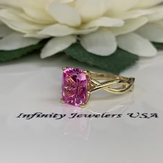 "This ring is an elongated cushion cut lab created pink sapphire solitaire, 14k yellow gold #6365 We feature the finest quality lab grown sapphires in the world. The properties of lab-grown are physically, chemically and visually identical to natural, just grown in a lab setting. -Approximate total carat weight: 3.20ctw diamond equivalent -Center Stone Size: approx. 3.20ct diamond equivalent -Center Stone Shape: cushion cut 10x8mm -Gem Type: lab created pink sapphire -Stone Clarity: VS2 -Stone C Pink 14k Gold Baguette Cut Jewelry, Gift Yellow Gold Radiant Cut Sapphire Ring, Radiant Cut Sapphire Ring In Yellow Gold, Pink Rectangular Ring With Accent Stones, Cushion Cut Pink Sapphire Jewelry, Pink Emerald Cut Solitaire Jewelry, Pink Cushion Cut Ring For Anniversary, Pink Emerald-cut Solitaire Jewelry, Classic Pink Radiant Cut Jewelry