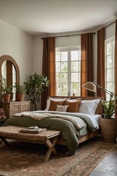 a bed room with a neatly made bed and lots of plants on the windowsill