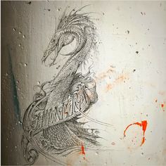 a drawing of a dragon on the side of a building