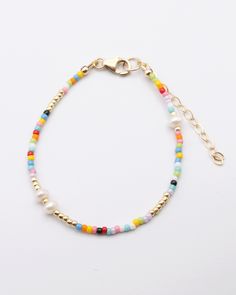 With the multicolor beads of the Marthe Bracelet pairing with so many outfit colors, you may just find yourself wearing this for most of the spring and summer! We especially love the special freshwater pearls mixed in with the seed beads here and there for a little something extra. Love this look? Add the Marthe Necklace for a complete look. About the Artisan Marie Marthe is a wonderful Haitian artisan that has been a part of our team for years! She is a talented seamstress and dedicated team me Elegant Beads Bracelet, Trendy Pearl Bracelet With Colorful Beads, Multicolor Beaded Bracelets For Spring, Everyday Pearl Bracelet With Colorful Round Beads, Multicolor Friendship Bracelets With Colorful Beads For Spring, Spring Multicolor Beaded Bracelets With Round Beads, Spring Multicolor Tiny Beads Friendship Bracelets, Spring Multicolor Friendship Bracelets With Tiny Beads, Adjustable Multicolor Pearl Bracelet With Colorful Beads