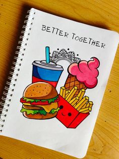 a notebook with a drawing of a burger, fries and drink on the cover that says better together