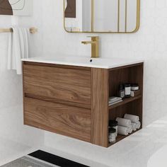 a bathroom with a sink, mirror and towel rack