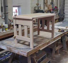 an unfinished table being built in a shop