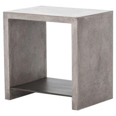 a concrete side table with one shelf open