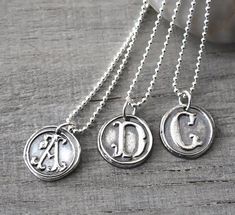 "Personalized Silver Wax Seal Initial Necklace - Fine Silver Custom Initial Charm with Sterling Silver Ball Chain This pendant is gorgeous and has such a great silver feel! The pendants are beautifully handcrafted and not machine cut, and each one has an organic handcrafted look and every letter is unique. This listing is for **ONE personalized initial necklace** with your choice of letter. ● CUSTOMIZED for you with *ONE* LETTER of YOUR CHOICE (A - Z) ● Please leave your choice of letter in the Symbolic Hand Stamped Sterling Silver Jewelry, Handmade Classic Jewelry For Personalized Gift, Symbolic Sterling Silver Engraved Charm Necklaces, Stamped Sterling Silver Pendant Jewelry, Silver Stamped Round Pendant Necklace, Nickel-free Symbolic Sterling Silver Necklace, Custom Sterling Silver Pendant Necklace, Nickel Free, Sterling Silver Stamped Round Necklace, Silver Necklace With Stamped Round Pendant