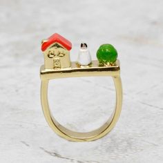 Show off your love for fairy tales with this enchanting Snow White Ring! Coco and Duckie thoughtfully curated this art piece that was lovingly crafted by truly imaginative artisans in Paris. Be unique by adding this fun ring to your jewel box! • Size 6, 18k gold plated• Clean with a soft jewelry polishing cloth. Never clean with any chemicals, chlorine or bleach.• Handmade in Paris Want to see more from N2 Paris? Click here! Hand Painted Gold Enamel Rings, Hand Painted Enamel Gold Rings, Gold Enamel Hand Painted Rings, Hand Painted Enamel Wedding Jewelry, Hand Painted Enamel Jewelry For Wedding, Hand Painted Enamel Jewelry For Weddings, Gold Enamel Ring For A Gift, Gold Enamel Ring Perfect For Gifting, Gold Enamel Ring Perfect For Gift