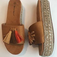 Nature Breeze Caprice Camel Wedge Sandals Espadrilles Faux Suede Upper 2 Inches Wedge Lined With Golden Cord And Tiny Sequins Tassels Orange Brown And Tan True To Size. These Are Cute And Will Give 2 Inches In Height. Great For Vacation. Any Questions Please Ask. New In Box. Cute For The Pool And Beach. Take A Pair On Your Vacation. Adjustable Brown Slip-on Wedge Sandals, Brown Espadrille Wedge Sandals For Vacation, Brown Synthetic Espadrilles For Summer, Brown Espadrille Wedge Heel Sandals, Brown Platform Sandals For Beach, Brown Espadrille Wedge Sandals For Summer, Spring Brown Synthetic Espadrilles, Brown Synthetic Espadrilles For Spring, Brown Synthetic Spring Espadrilles