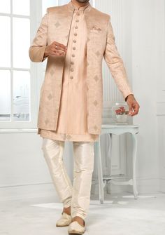 Readymade Art Silk Sherwani, and Jacket. Art Dupion Aligarhi Ready Made Trouser. Resham, Sequences, and Zari Work. Crafted in Chinese Collar Neck, and Full Sleeve. Faux Satin Lining with Plain Work. High-Quality Matching Buttons. Please Note: The footwear shown in the picture is for presentation and photography purpose only. Color: There might be slight color variation due to lightings and flashes while photo shooting. The color may also vary because of different screen resolutions. Wash Care: D Fitted Nehru Jacket With Naqshi Straight Kurta, Fitted Nehru Jacket With Naqshi In Straight Kurta Style, Designer Front Open Kurta With Cutdana, Elegant Nehru Jacket With Cutdana In Traditional Drape, Elegant Nehru Jacket With Cutdana Detailing, Elegant Nehru Jacket With Cutdana, Designer Nehru Jacket With Zari Work For Transitional Season, Transitional Nehru Jacket With Zari Work, Eid Nehru Jacket With Zari Work In Raw Silk