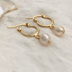 Excited to share this item from my #etsy shop: Tiny gold hoops, Pearl hoop earrings gold, Dainty hoop earrings, jr bridesmaid gift, huggie hoop earrings gold, delicate bridal earrings. #gold #wedding #circle #lovefriendship #pearl #shell #latchback #minimalist #hoops #minihoops #freshwaterpearls #bridesmaid #bridetobe Gold-plated Hoop Earrings With Pearl Drop For Anniversary, Gold Plated Hoop Earrings With Pearl Drop For Anniversary, Gold 14k Gold Filled Huggie Earrings With Pearl Drop, Gold Minimalist Huggie Earrings With Pearl Drop, Delicate Small Hoop Huggie Earrings, Dainty Huggie Earrings For Wedding, Dainty Small Hoop Huggie Earrings With Pearl Charm, Delicate Yellow Gold Huggie Earrings For Wedding, Gold Delicate Pearl Earrings For Bridesmaid