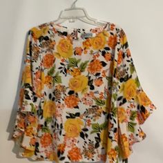 Kasper 100% Polyester Top - Blouse - Shirt White Background Floral Design Size Petite Extra Large (Pxl) Petite Plus Size New Without Tags The Flower Details Are Tangerine, Yellow, Peach, Black, Tan And Green. Set In Bell Sleeves - 3/4 Length- Ruffle Cuff Boat Neckline With Keyhole Back One Button Closure Measurements- Front Armpit To Armpit - 24” Back Armpit To Armpit- 24” Length - 25” Sleeve Length - 16” This Top Can Be Worn To Dress Up Or Dress Down. Pair With Jeans, Dress Pants, Trousers, Ski Summer Orange Printed Blouse, Yellow Floral Print Top For Spring, Spring Yellow Floral Print Top, Spring Orange Printed Tops, Orange Printed Tops For Spring, Orange Spring Vacation Shirt, Trendy Printed Yellow Blouse, Trendy Yellow Printed Blouse, Orange Vacation Shirt For Spring