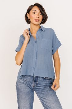 Summer Collared Denim Blue Blouse, Summer Denim Blue Collared Blouse, Denim Blue Summer Blouse For Work, Blue Collared Top With Roll-up Sleeves, Blue Shirt With Roll-up Sleeves And Shirttail Hem, Summer Workwear Blouse In Washed Blue, Summer Washed Blue Button-up Shirt, Washed Blue Button-up Shirt For Summer, Summer Workwear Washed Blue Blouse