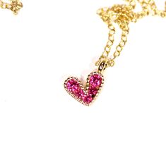 Tiny heart necklace - pink heart necklace - gold heart necklace - love necklace - bff necklace An itty bitty magenta pink heart having happily from a 14k gold vermeil chain at the length of your choice! This tiny, gold plated brass heart holds 5 sparkly crystals. Heart measurement: 8mm Looking for other charm necklaces? https://www.etsy.com/shop/BubuRuby?section_id=12318467 More from Bubu Ruby? https://www.etsy.com/shop/BubuRuby?ref=si_shop ♥ Handmade with love in sunny California ♥ These gems w Cute Gold Heart Necklace With Heart Beads, Dainty Pink Heart Cut Necklaces, Dainty Pink Heart Cut Necklace, Tiny Charm Necklaces For Valentine's Day, Dainty Pink Heart Necklace For Valentine's Day, Cute Pink Heart Pendant Necklace, Cute Gold Necklaces With Heart Charm, Cute Gold Necklace With Heart Charm, Valentine's Day Pink Necklace With Delicate Chain