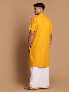 VASTRAMAY Men's Mustard Cotton Kurta And Mundu Set Add a touch of tradition to your wardrobe with this mustard cotton kurta and mundu set from VASTRAMAY. Perfect for special occasions or festive events, this set offers comfort and style. The kurta features a classic design with intricate detailing, while the mundu adds an elegant touch. Made from high-quality cotton, this set is easy to maintain and durable, ensuring long-lasting wear. Features: Mustard cotton kurta with intricate detailing Come Yellow Cotton Silk Kurta For Festivals, Cotton Silk Kurta For Puja During Transitional Season, Transitional Cotton Silk Kurta For Puja, Yellow Cotton Kurta With Dabka Detail, Yellow Cotton Kurta With Dabka, Yellow Cotton Kurta With Dabka Embroidery, Yellow Cotton Silk Kurta With Pallu, Traditional Mustard Cotton Kurta, Cotton Straight Kurta For Navratri