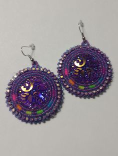 Hand-made beaded earrings: Colors: Purple w/neon colors  Closure: Hook size: 2 inches Handmade Round Beaded Earrings For Festivals, Purple Beaded Festival Earrings, Purple Beaded Earrings For Festival, Nickel Free Beaded Earrings For Festival, Purple Beaded Earrings With Round Beads For Festival, Nickel Free Round Beads Earrings For Festival, Festival Purple Beaded Earrings With Round Beads, Handmade Multicolor Beaded Earrings For Party, Purple Earrings With Colorful Beads For Crafting