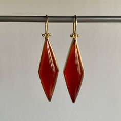 Rich vermillion color balances elegance with extravagance in these strikingly structured carnelians. 18k yellow gold Carnelian, 31.8ctw, 11mm x 38mm (7/16" x 1 1/2")Earrings hang 2 1/16" from the ear Each earring weighs 5.3g