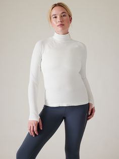 FOR: Training in cold weather climates FEEL: Seamless construction for maximum comfort and minimal chafing FAVE: Thumbholes hold sleeves in place and keep warmth in Fitted next to the body Regular length, hits at low hip T-neck Body length in size medium: Regular: 24". Lapis Blue, Weather And Climate, Turtleneck Top, Turtle Neck Top, Free Fabric, Cold Weather, White And Black, Turtle Neck