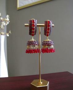 Red & Gold Jhumka Earrings perfect for any Pakistani/Indian wedding event! **All products are handmade and triple checked before shipping to ensure premium quality** Red Chandelier Earrings For Festive Parties, Festive Red Chandelier Earrings For Party, Red Chandelier Earrings For Party And Festive Occasions, Traditional Ruby Bridal Earrings For Party, Red Bridal Earrings For Festive Party, Red Bridal Earrings For Party, Festive Red Bridal Earrings For Party, Elegant Red Danglers For Festive Occasions, Elegant Red Danglers For Festive Events