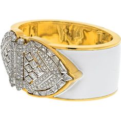 Bask in the brilliance of fine craftsmanship and innovative design with the David Webb Platinum & 18K Yellow Gold White Enamel Shield Diamond Clips Cuff Bracelet. This exquisite piece of jewelry exudes old Hollywood glamour, featuring platinum diamond shield-shaped ends that can be detached and worn as double clips. Adorned with a dazzling array of step-cut and brilliant-cut diamonds, this bracelet is a testament to elegance and sophistication.The design, crafted with white enamel, imbues the piece with a timeless quality, ensuring it remains a cherished heirloom for generations. Measuring around 6 inches in circumference, this bracelet is designed for a small wrist size, making it a perfect fit for those who appreciate bold yet refined accessories. The width of approximately 1.2 inches en Luxury Diamond Bangle With Polished Finish, Luxury White Gold Cuff Bracelet, Luxury White Pavé Setting Bracelet, Luxury White Bracelet With Pave Setting, Luxury White Bracelet For Evening, Luxury White Bracelets For Evening, Luxury Polished Finish Bangle For Formal Occasions, Luxury Bangle With Polished Finish For Formal Occasions, Luxury Polished Formal Bangle