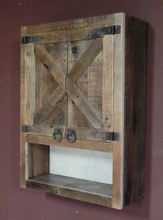 a wooden shelf with two doors on it