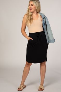 A basic skirt with side pockets and an elastic drawstring waist. The Black Maternity Skirt is perfectly bump-friendly! Casual Skirt With Elastic Waistband For Everyday, Versatile Relaxed Skirt With Pockets, Casual Everyday Skirt With Elastic Waistband, Relaxed Drawstring Skirt For Work, Casual Mini Cargo Skirt With Elastic Waistband, Casual Drawstring Skirt For Work, Casual Stretch Pencil Skirt For Day Out, Casual Lined Midi Pencil Skirt, Casual Midi Pencil Skirt With Lining