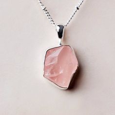 Fulfilled by our friends at Tiny RitualsFill your cup of love with the raw Rose Quartz Necklace. Celebrated in the crystal guide as being the ultimate heart chakra crystal, this pretty pink crystal is here to crack you open and nurture compassion, gentle communication, and dreamily deep bonds. “With this necklace, I nurture loving compassion with myself and those around me.” Description Rose Quartz is one of the most popular crystals out there - from gemstone bracelets to zodiac bracelets, palm Pink Spiritual Crystal Gemstone Necklace, Spiritual Pink Gemstone Crystal Necklace, Pink Spiritual Gemstone Crystal Necklace, Rose Quartz Crystal Necklaces With Gemstone For Gift, Rose Quartz Crystal Necklace As Gift, Pink Rose Quartz Crystal Necklace With Natural Stones, Delicate Pink Gemstone Crystal Necklace, Pink Quartz Jewelry As A Gift, Pink Quartz Jewelry As Gift