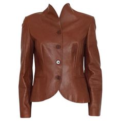 Lamb leather (100%) Cognac color Four buttons closure Two pockets Shoulder length / hem cm 54 (21.3 inches) Shoulder width cm 40 (15.7 inches) Presence of some spots on the back and the sleeve see pictures Designer Brown Leather Jacket For Business, Elegant Brown Blazer With Button Cuffs, Designer Brown Blazer With Buttons, Formal Leather Outerwear With Button Cuffs, Tailored Brown Leather Jacket For Work, Brown Stand Collar Blazer With Button Closure, Brown Blazer With Button Closure And Stand Collar, Formal Leather Jacket With Button Cuffs, Fitted Brown Leather Button-up Jacket