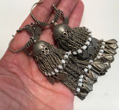 These Antique earrings were handcrafted by a kuchi member in Afghanistan ,  metal they utilized  is commonly known as  German silver or glit as they call it in Afghanistan.  These earrings are in excellent condition and ready to wear. Measurements is 10.5cm long #8E Silver Vintage Beaded Earrings With Dangling Beads, Vintage Beaded Drop Earrings For Festivals, Bohemian Oxidized Danglers For Festival, Vintage Dangle Beaded Earrings For Festival, Traditional Nickel-free Beaded Dangle Earrings, Traditional Brass Beaded Earrings For Festival, Traditional Metal Chandelier Earrings With Dangling Beads, Bohemian Oxidized Finish Danglers, Vintage Silver Beaded Earrings Nickel Free