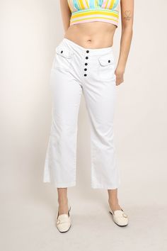 FEATURES - 1970s pants - White, blue colors - Mod style - White lightweight denim fabric - Accent stitching - Accent pockets on the front of the hips - Bell bottoms - Low rise - Button fly CONDITION Great vintage condition: faint water ring-like area on the very lower left pant leg on the front and back. MEASUREMENTS & FIT suggested number / letter size: 26 or 27 S rise: 10.25" waist: 28.5"-29" (size down 1.5"-2" due to low rise not hitting at true waist) hip: 36"-38" length: 36" inseam: 25.5" thigh: 10"-10.5" across (20"-21" around) color: white, blue material: feels like cotton, denim, jean, buttons label: no label pinned on model? no Note on fit: Fit was loose in the hips. Adrianne is 5'10 33-25-36 with a modern dress size 2-4, letter size XS/S and a size 26 in jeans. All items are meas Casual Flare Bottoms With Buttons, High Waist Cotton Flares For Summer, Spring Wide Leg Flare Jeans With Buttons, Summer High Waist Cotton Flares, Summer High-waist Cotton Flares, Retro Cotton Wide Leg Pants With Pockets, Retro Wide Leg Cotton Pants With Pockets, Cotton Flare Jeans With Pockets, High Waist Cotton Wide Leg Pants With Buttons