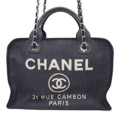 Used Chanel Handbag Deauville Coco Mark Canvas A92750 Chanel 2way Shoulder Bag (Sku: Gzl13y9y) === General === Brand : Chanel === Design === Type : Handbag, Shoulder Bag Material : Canvas , Leather Color : Navy Gender : Women === Size === Size (Hxwxd) : 22cm X 32cm X 14cm / 8.66'' X 12.59'' X 5.51'' === Included Items === Accessories : Box, Dust Bag, Guarantee Card Accessories Notice : Before Purchasing, Please Refer To The Images Of The Accessories Included With The Item. === Condition === Condition : Used (Very Good) Ranking : Rank A Used - A Few Traces Of Usage, Some Scratches / Dirt Can Be Seen But Overall In Very Good Condition Seller Ranking : Rank A Overall Scratches : Sli Designer Travel Bags With Round Handle, Luxury Blue Bag With Round Handle, Luxury Blue Bags With Round Handle, Evening Tote Bag In Coated Canvas, Evening Coated Canvas Tote Bag, Luxury Shopping Bags With Round Handle, Luxury Shopping Bag With Round Handle, Designer Double Handle Bag With Rolled Handles, Designer Travel Satchel With Round Handle