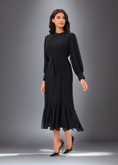 Discover timeless sophistication with the "Classic Elegance Midi Dress." This exquisite black dress features a pleated design that falls beautifully. It extends 49.5 inches from the high point of the shoulder, offering a flattering midi length. A detached self-belt ensures a perfect fit, while detailed cuffs add a touch of class. Fully lined, except for the sleeves, this dress promises comfort and style. Please refer to our body measurements guide for your best fit. Hand wash, line dry, cool iron. Do not bleach or tumble dry. Sweater Skirt Outfit, Spring Skirts, Spring Tops, High Point, Black Midi Dress, Classic Elegance, Spring Dresses, Our Body, Skirt Outfits