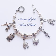 "Place your order today, to have it in time for Christmas!!  The receiver will love it!! Beautifully handrafted \"Armor of God \" bracelet with Antique Silver Charms. The charms features:  Helmet of Salvation, Breastplate of Righteousness,  Belt of Truth,  Shoes of Peace, Shield of Faith and the Sword of the Spirit. Biblical Scriptures found in Ephesians 6:10-1, explains what the Full Armor of God is. Protection from God! Standard size is 7 1/2 inches long. Please indicate in a message if you need a different size. Leave me a note to let me know which box you would like." Spiritual Metal Charm Bracelet As Gift, Armour Of God Bracelet, Spiritual Cross Charm Bracelet Gift, Spiritual Hand-strung Charm Bracelet As Gift, Armour Of God Belt Of Truth, Christian Charm Bracelet, Helmet Of Salvation, Belt Of Truth, Shield Of Faith