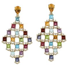 These multi gemstone earrings are handmade in 18 Karat gold. It is beautifully detailed with 19.95 carats amethyst, citrine, garnet, peridot, topaz and 1.39 carats of sparkling diamonds. FOLLOW MEGHNA JEWELS storefront to view the latest collection & exclusive pieces. Meghna Jewels is proudly rated as a Top Seller on 1stdibs with 5 star customer reviews. All items manufactured by us are handmade and can be customized or redesigned. Composition Size-57X30 MM Total Weight-22.81 Gold Weight(Gms Luxury Multi-stone Fine Jewelry Earrings, Luxury Multicolor Earrings With Gemstone Accents, Multicolor Gemstone Accented Earrings For Formal Occasions, Formal Multicolor Gemstone Earrings, Premium Jewelry, Diamond Dangle Earrings, Art Deco Diamond, Blake Lively, Top Seller