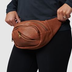 No matter if you’re wearing it over the shoulder or around the waist—our Crew Fanny Pack keeps all of your small essentials secure with plenty of style thanks to the faux leather material. With four zippered compartments, it’s perfect for everyday outings, travel days, sightseeing, morning walks, and anywhere else you take it. Brown Travel Belt Bag With Zipper, Brown Crossbody Belt Bag With Zipper Closure, Casual Brown Leather Belt Bag, Versatile Leather Belt Bag With Pockets, Brown Soft Leather Travel Belt Bag, Brown Belt Bag With Zipper Pocket, Modern Brown Belt Bag With Zipper Pocket, Brown Leather Belt Bag With Zipper Closure, Casual Brown Belt Bag With Belt Loops