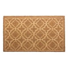 a door mat with an intricate design on the front and back side, in light brown