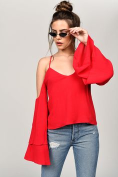 With Wide, Double Layer Sleeves, You Won'T Be Able To Resist Making Shapes With The Red Jillian Cold Shoulder Blouse. A Peasant Blouse You Can Wear In The Evening, The Backless Blouse Has Deep Cold Shoulder Cutouts And Delicate Shoulder Straps, With Ties At The Back. Live The Drama. Red Off-shoulder Tops For Fall, Red Off-shoulder Top For Evening, Fall Off-shoulder Blouse With Blouson Sleeves, Fall Off-shoulder Red Tops, Cold Shoulder Blouse For Night Out In Fall, Off-shoulder Blouse With Blouson Sleeves For Fall, Fall Blouse With Blouson Sleeves And Off-shoulder Design, Fall Season Red Off-shoulder Tops, Summer Off-shoulder Top With Blouson Sleeves