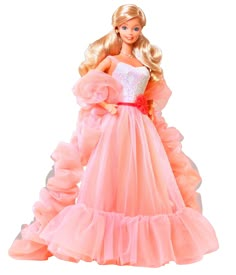 the barbie doll is wearing a pink dress