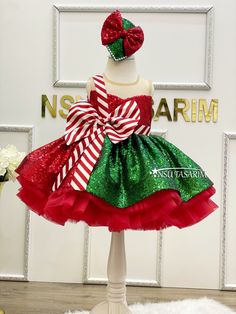 Introducing Our Enchanting Christmas Holiday Dress for Girls The magic of the holiday season comes to life with our exquisite knee-length, flared Christmas holiday dress specially designed for your little princess. Make this festive season unforgettable with this delightful creation. This Christmas holiday dress is a vision of yuletide joy, featuring a rich red and green sequined fabric. The vibrant colors, paired with its sleeveless design, ensure your child will look and feel like the belle of Green Christmas Princess Dress For Dress-up, Sleeveless Christmas Princess Dress For Holiday, Sleeveless Christmas Holiday Princess Dress, Sleeveless Princess Dress For Christmas Holiday, Sleeveless Holiday Princess Dress For Festive Occasions, Christmas Pageant Sleeveless Tutu Dress, Christmas Pageant Sleeveless Holiday Dress, Sleeveless Christmas Tutu Dress, Festive Sleeveless Christmas Dress