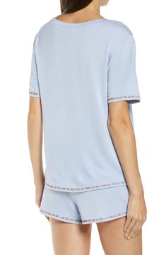 Short-sleeve pajamas in a blissfully soft knit you'll want to live in are detailed with colorful embroidery. 23" top length; 2 1/2" inseam; 14" leg opening; 9 1/2" front rise; 12 1/2" back rise Top has crewneck; short sleeves Shorts have drawstring waist 95% rayon, 5% spandex Machine wash, line dry Imported Casual V-neck Tops For Pajama Party, Short Sleeve Sleep Tops For Spring, Comfortable Tops For Bedtime In Spring, Comfortable Tops For Spring Bedtime, Comfortable Spring Bedtime Tops, Summer Bedtime Crew Neck Top, Comfortable Fitted Tops For Loungewear, Comfortable Fitted Loungewear Tops, Spring Crew Neck Sleepwear For Lounging